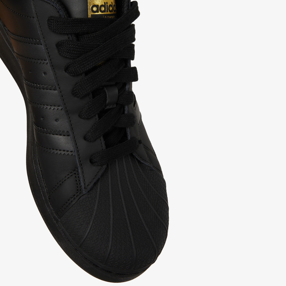 Black and gold hot sale high top adidas