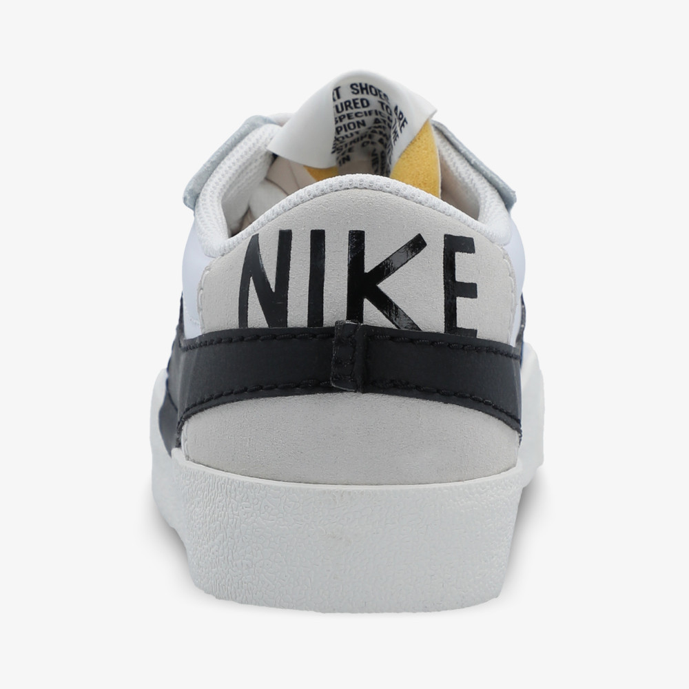 Nike blazer low black hot sale white